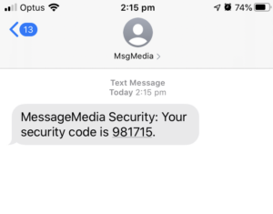 Phone with a two factor authentication message in the screen confirming a one-time security code.