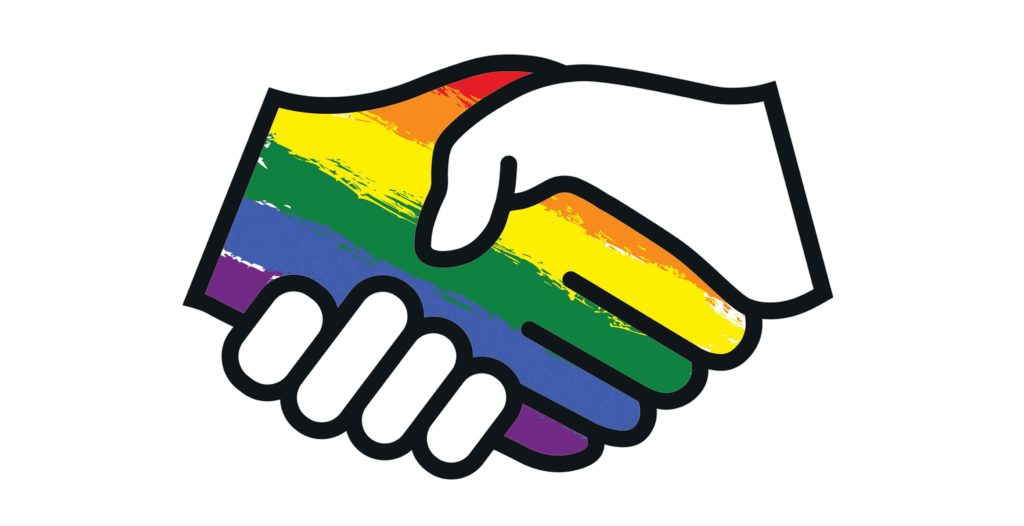 An image if a rainbow-coloured hand and a white hand shaking