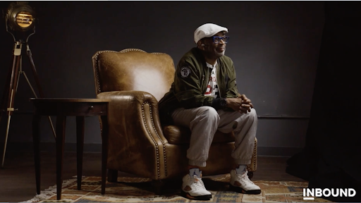 Spike Lee sitting on a chair